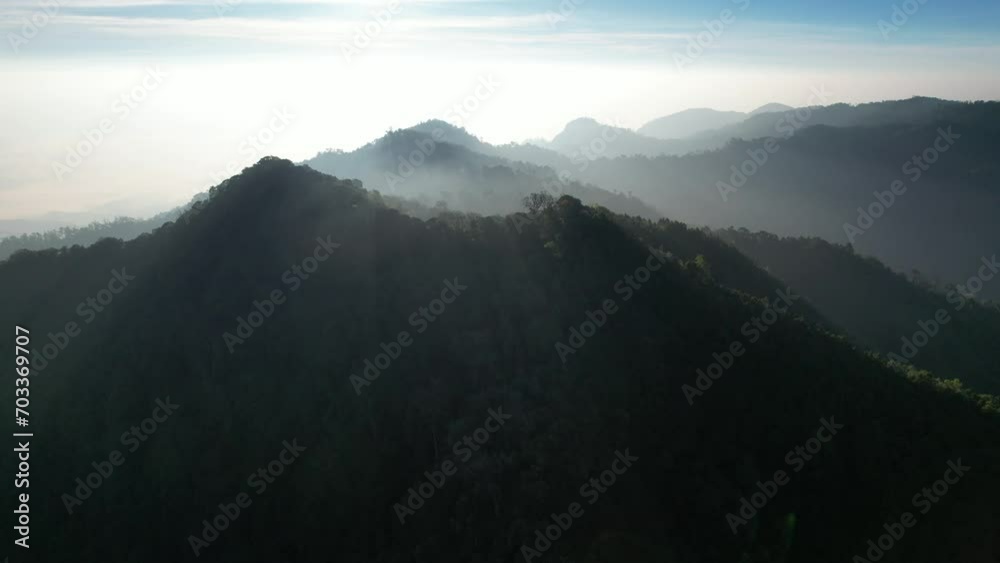 Aerial landscape view of greenery rainforest and hills in the morning by drone Aerial landscape view of greenery rainforest and hills in the morning by drone
