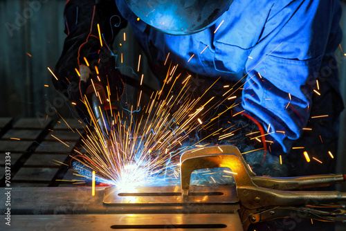 When workers weld using gas argon to steel, sparks are created that result in smoke within factory