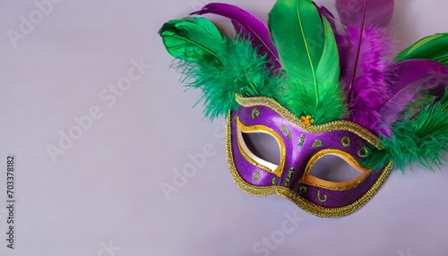 elegant venetian mask with purple and green feathers for the festival mardi gras