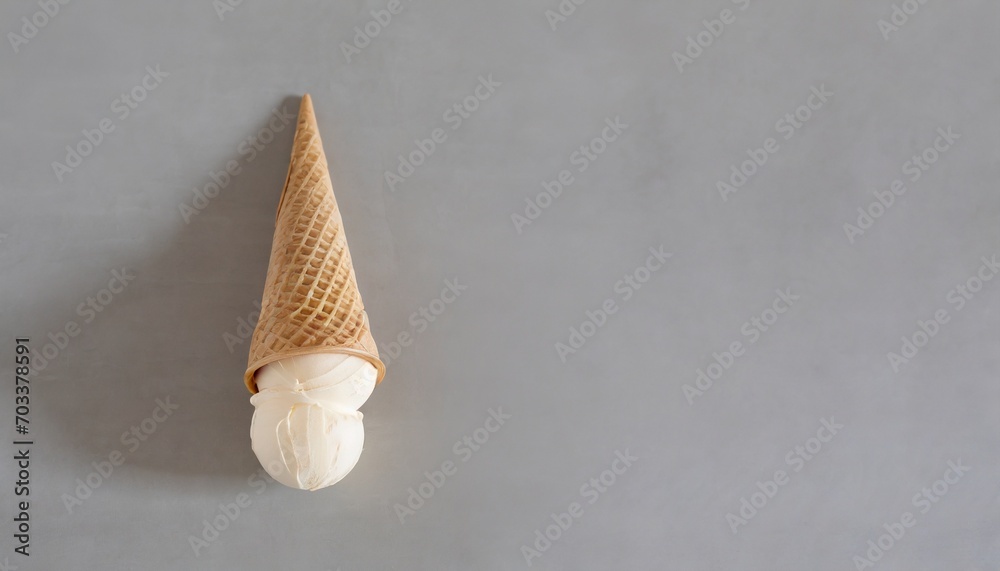 ice cream cone upside down isolated on a neutral grey background copy space