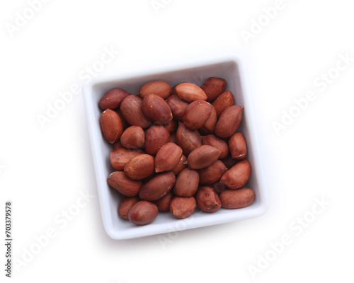 Fresh roasted peanuts isolated on white background.