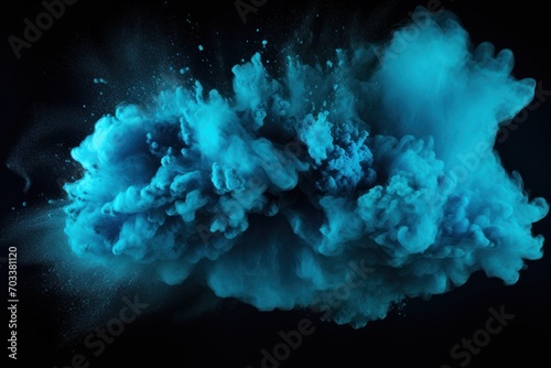 Explosion of turquoise blue colored powder on black background