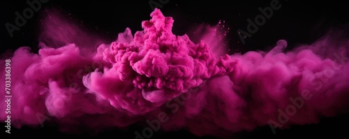 Explosion of magenta pink colored powder on black background