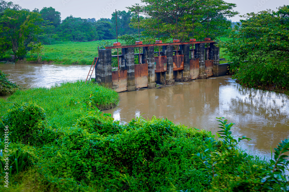 Fototapeta premium A dam was built in the middle of a small river which is still functioning in Sri Lankla
