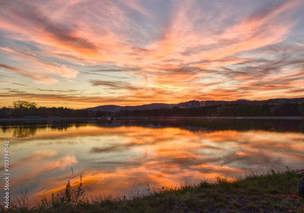 Fototapeta premium Fiery sunset on the water 