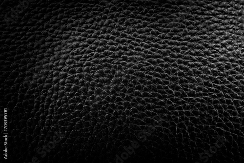 Black leather texture with gradient. Background made of genuine leather