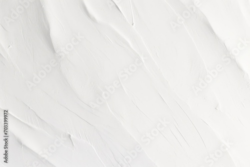 Decorative white background. Wall texture with filler paste applied with spatula, chaotic dashes and strokes. photo
