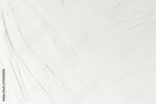 Decorative white background. Wall texture with filler paste applied with spatula, chaotic dashes and strokes.