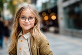 Health care, clear vision, specs, lenses pre teens concept. Close up portrait of charming blonde schoolgirl outdoors