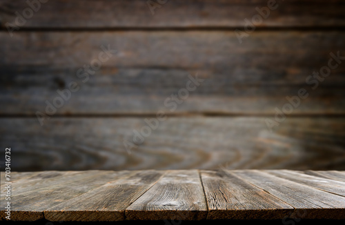 Empty rustic wooden table background. Old wood table with dark blurred background. Mock up. photo