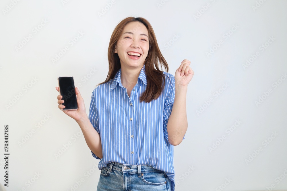 portrait of a smiling woman holding smartphone over isolated background. portrait of a smiling woman holding smartphone over isolated background.