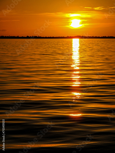 Por do sol no Rio Amazonas photo