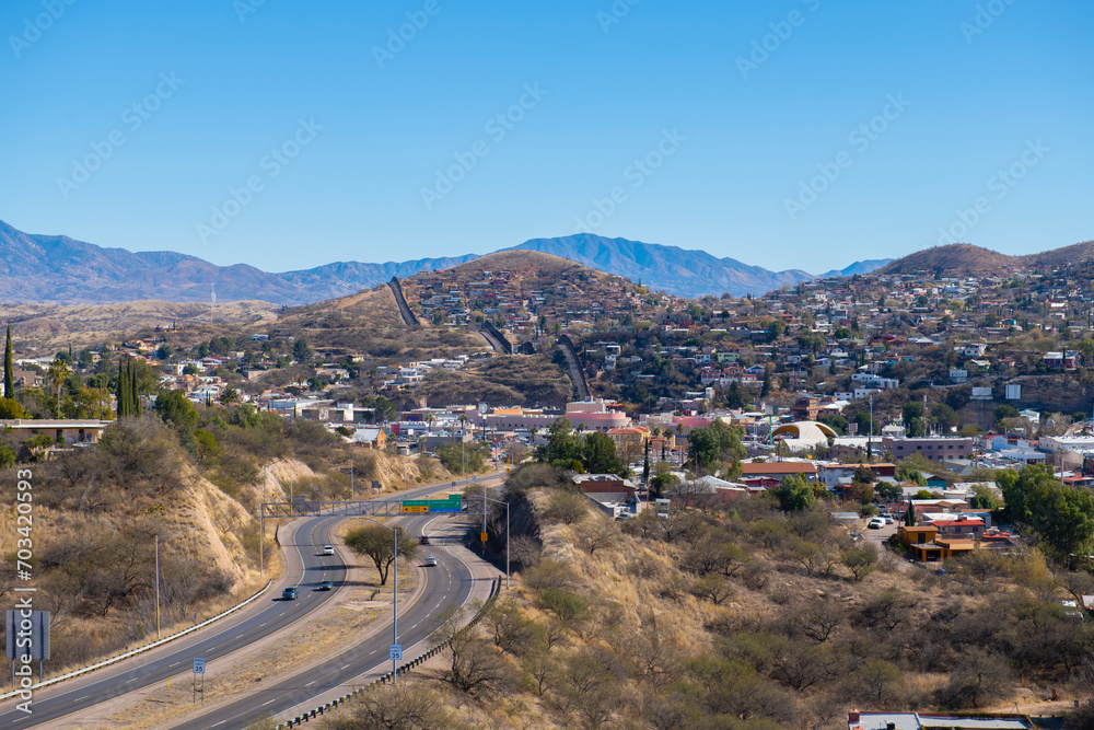 Aerial view of Nogales Sonora with Border Wall between Nogales Arizona USA and Nogales Sonora Mexico near International Street in city of Nogales, Arizona AZ, USA. 