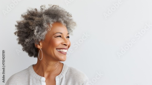 Side Profile of a Joyful Mature African American Woman with Natural Curly Hair