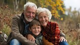 Affectionate Grandparents with Grandson in Autumn Countryside