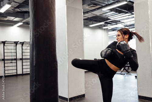 Athletic girl training Muay Thai boxing for bodybuilding and healthy lifestyle concep