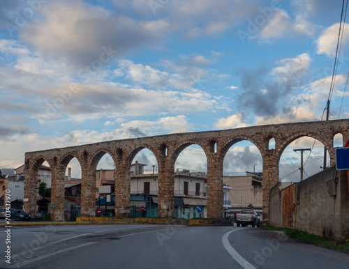 The old aqueduct on the street of the city of Chalkida on Evia island in Greece photo