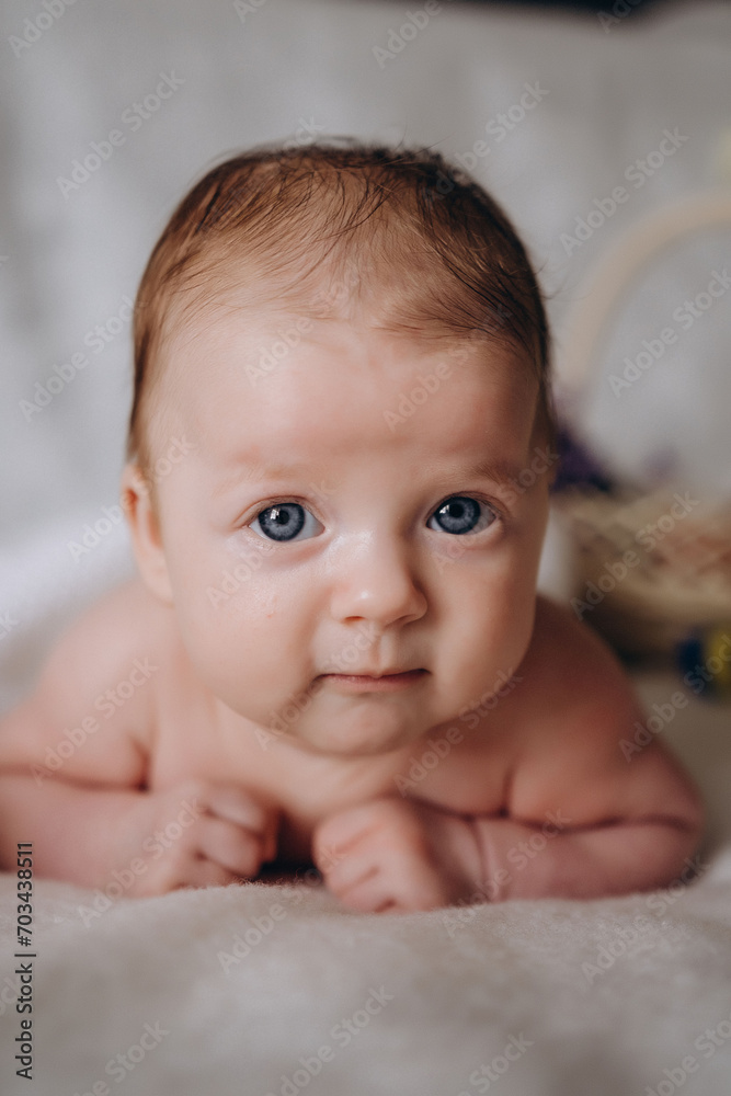 Cute little baby on Easter looks at camera and smiles. Ukraine. peaceful Easter Cute little baby on Easter looks at camera and smiles. Ukraine. peaceful Easter