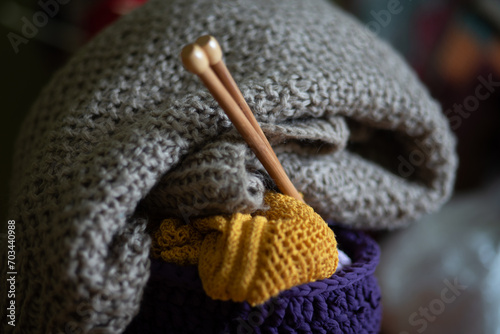Fototapeta Naklejka Na Ścianę i Meble -  unfinished knitted work, needlework concept, homemaker's work, knitting as a hobby, hobby as needlework