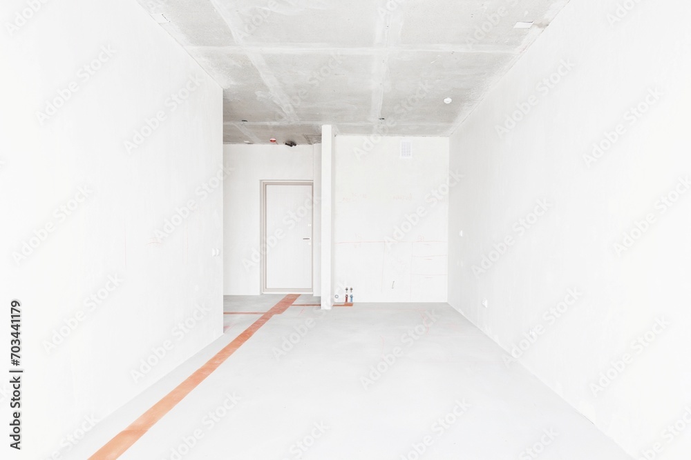 Fototapeta premium interior of the apartment without decoration in gray colors. rough finish