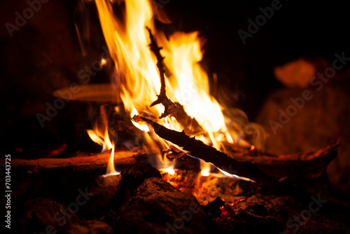 dark scene of camp fire with pot, lifestyle people concept