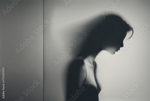 shadow silhouette of a woman, melancholy concept © Anna Gold Stock