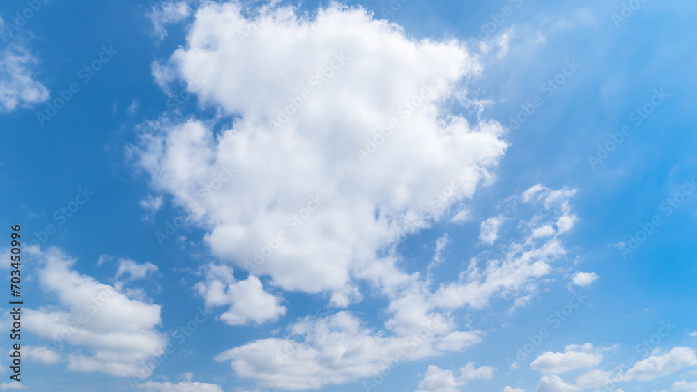 Panoramic view of clear blue sky and clouds, Blue sky background with tiny clouds. White fluffy clouds in the blue sky. Captivating stock photo featuring the mesmerizing beauty of the sky and clouds. Panoramic view of clear blue sky and clouds, Blue sky background with tiny clouds. White fluffy clouds in the blue sky. Captivating stock photo featuring the mesmerizing beauty of the sky and clouds.