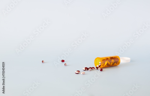 Scattered pills on a light background with copy space. Medication concept, pharmaceutical industry.