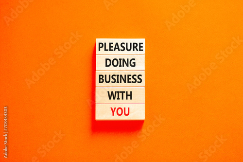 Pleasure doing business with you symbol. Concept words Pleasure doing business with you on wooden blocks. Beautiful orange table orange background. Pleasure doing business with you concept. Copy space