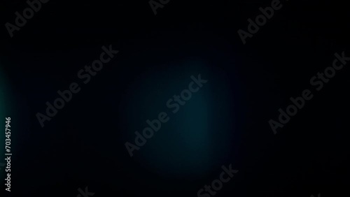 Glass light lens flare light leaks overlay on a black background photo