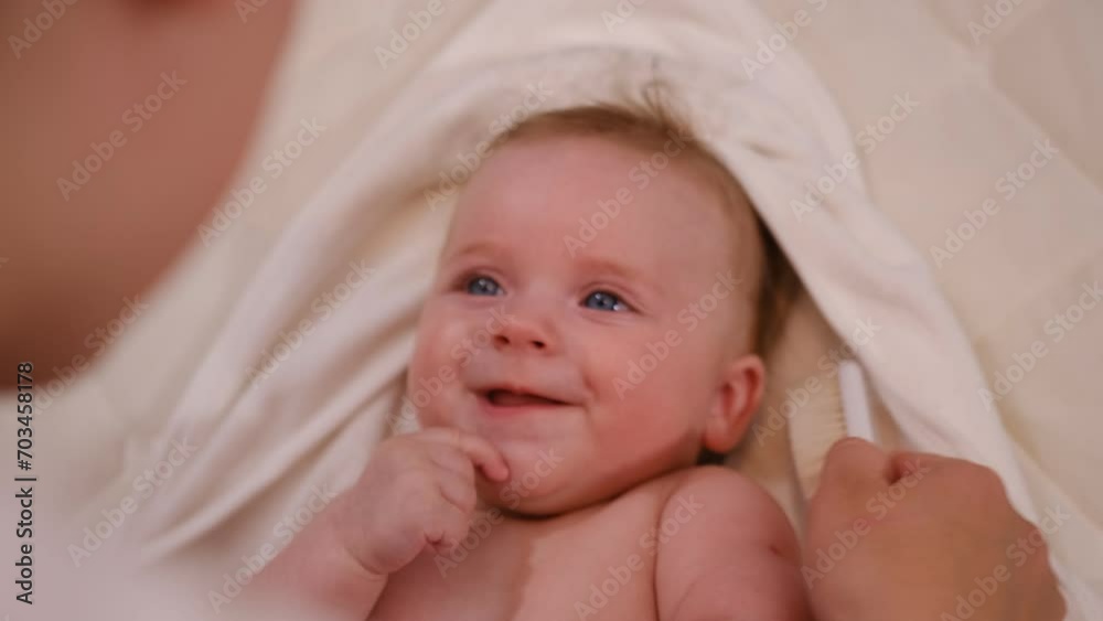 A portrait of a small child being scratched on the head with a brush. Combing the hair of a newborn baby. Hygiene and human care. Children's look. A portrait of a small child being scratched on the head with a brush. Combing the hair of a newborn baby. Hygiene and human care. Children's look.