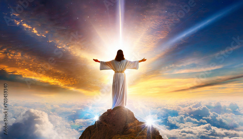 Jesus Christ on the top of the mountain with rays of light.