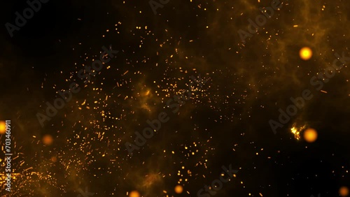 Golden particles fly and burn, background with fire photo