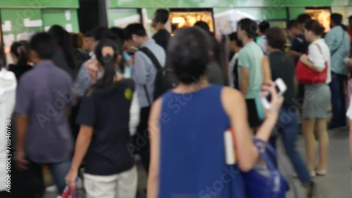 Asian commuters at the city train station  photo