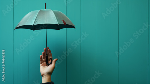 An umbrella-wielding man's hand with copy space on a blue-green backdrop. Concept of safety and protection A contented young lady and her dog are taking a train ride. The idea of pet-friendly travel