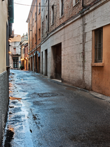 old town alley - dark city street after rain