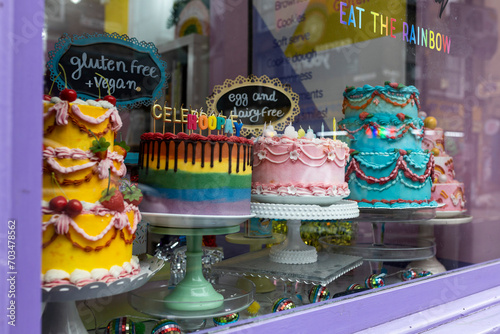 London, UK - December 20, 2023, colorful cakes in a display case, gluten free photo