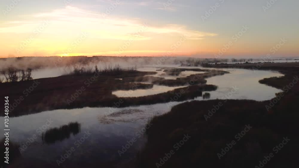 Colorful fog over the lake in autumn at dawn Colorful fog over the lake in autumn at dawn