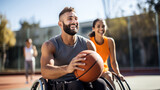 Man and a woman, both in wheelchairs, playing basketball