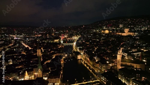 Wallpaper Mural Aerial view over the old town of City of Zürich with city lights and traffic on a dark winter night. Movie shot January 5th, 2024, Zurich, Switzerland. Torontodigital.ca