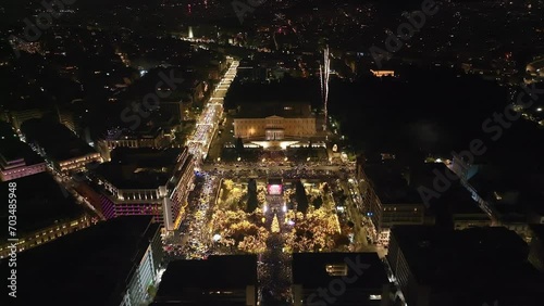 Aerial drone night video of illuminated iconic Syntagma square at new year's eve celebration welcoming 2024, Athens, Attica, Greece photo