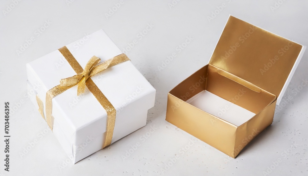 two white boxes mockup with golden wrapping paper opened and closed on light background