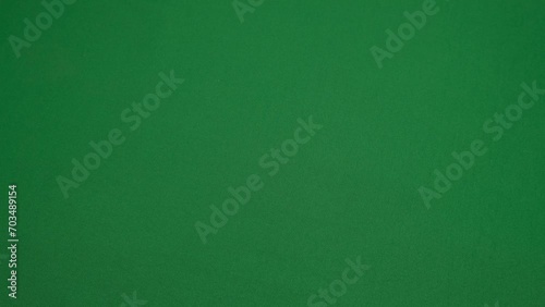 Transferring a wad of money, American dollar on a green background. photo