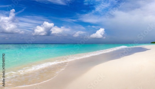 beautiful sandy beach with white sand and rolling calm wave of turquoise ocean on sunny day on background white clouds in blue sky island in maldives colorful perfect panoramic natural landscape © Florence