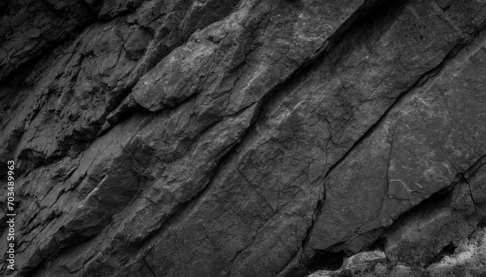 black white rock texture dark gray stone granite background for design rough cracked mountain surface close up crumbled