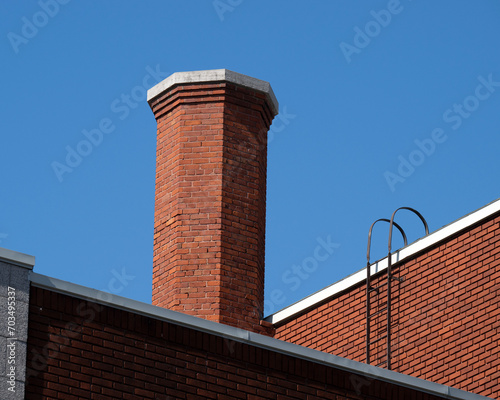 A commercial red brick chimney