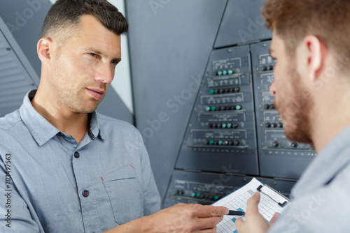 aero engineer and apprentice working in hangar