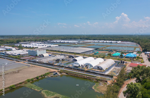 Aerial top view of metropolitan provincial waterworks industry factory in urban city town. Water utilities service. photo