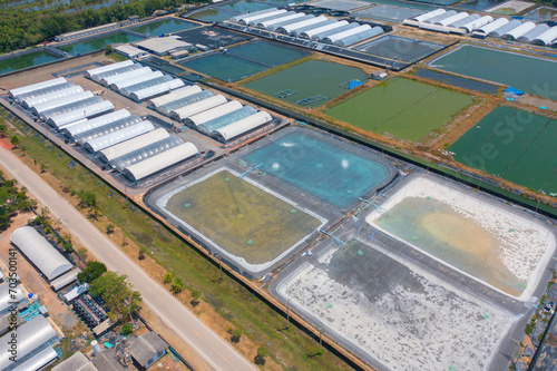 Aerial top view of metropolitan provincial waterworks industry factory in urban city town. Water utilities service.