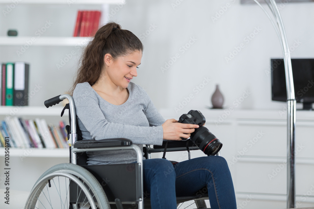 disabilty and handicap young disabled woman using her camera disabilty and handicap young disabled woman using her camera